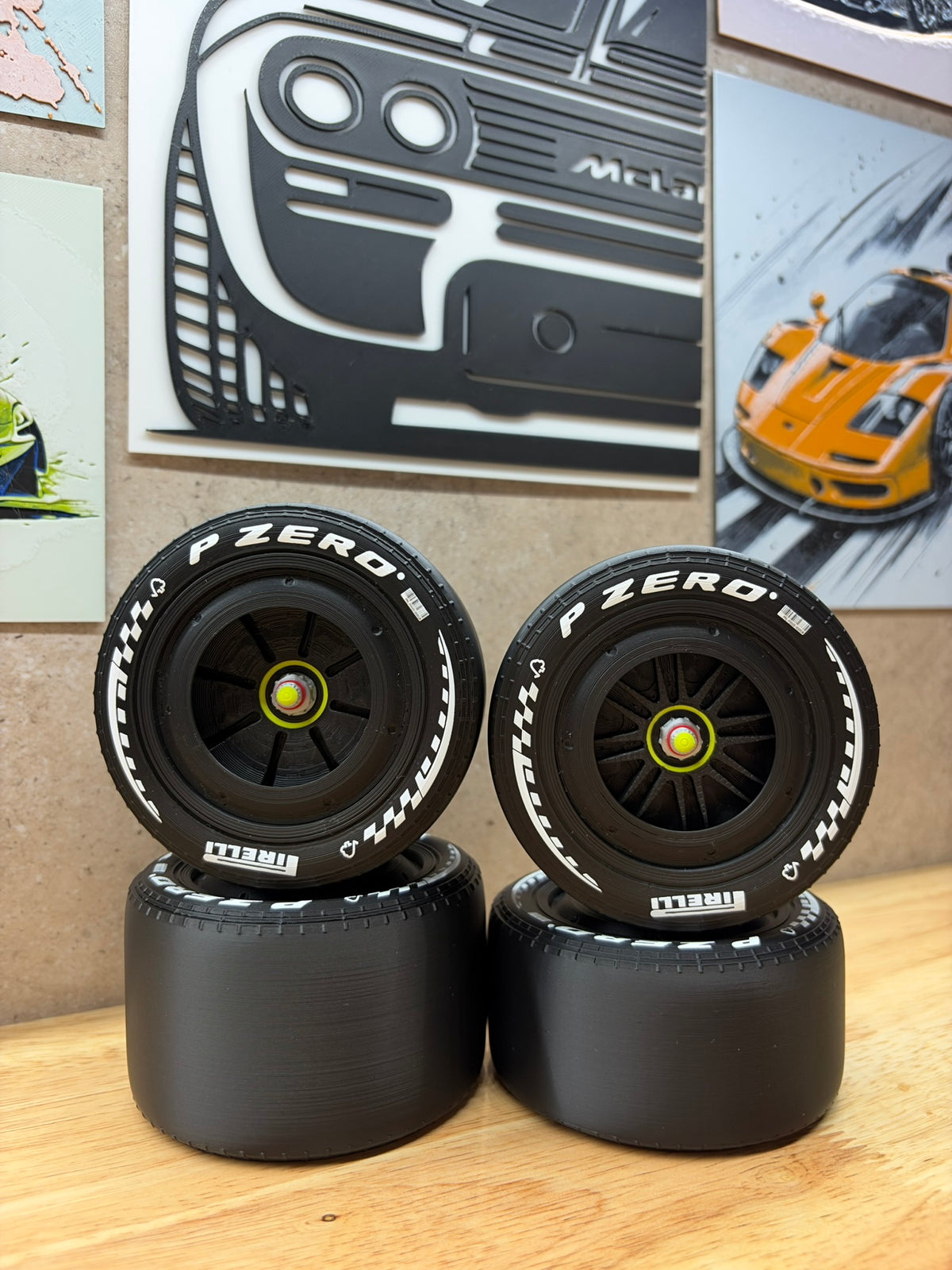 2026 Ferrari F1-style 3D-printed black racing wheels for 1:8 scale models, featuring white P Zero tyre markings, black spoke designs and detailed centre-lock hubs.