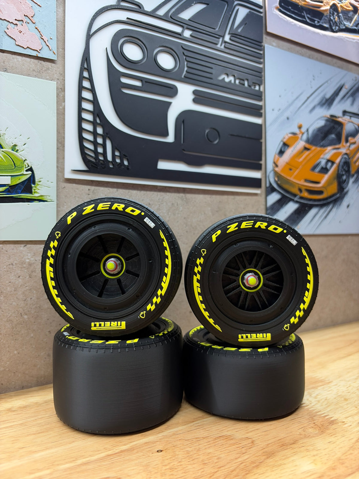 2026 Ferrari F1-style 3D-printed black racing wheels for 1:8 scale models, featuring yellow P Zero tyre markings, black spoke designs and detailed centre-lock hubs.