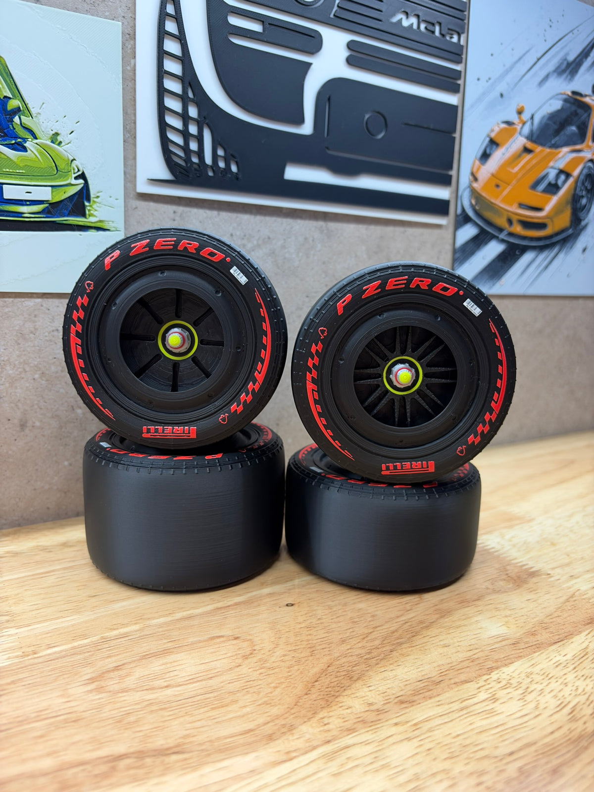 2026 Ferrari F1-style 3D-printed black racing wheels for 1:8 scale models, featuring red P Zero tyre markings, black spoke designs and detailed centre-lock hubs.