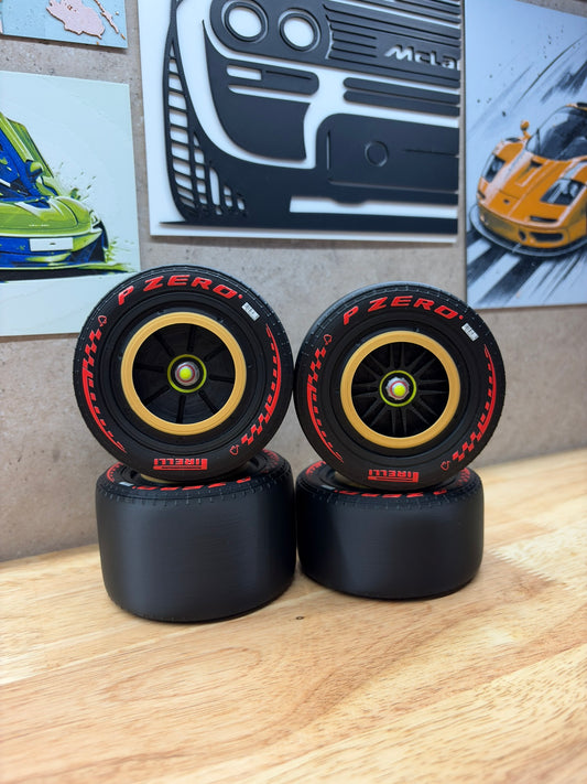 2026 Ferrari F1 Schumacher Monza Tribute 3D-printed wheels for 1:8 scale models, featuring red P Zero tyre markings, black spokes and distinctive gold wheel rims.