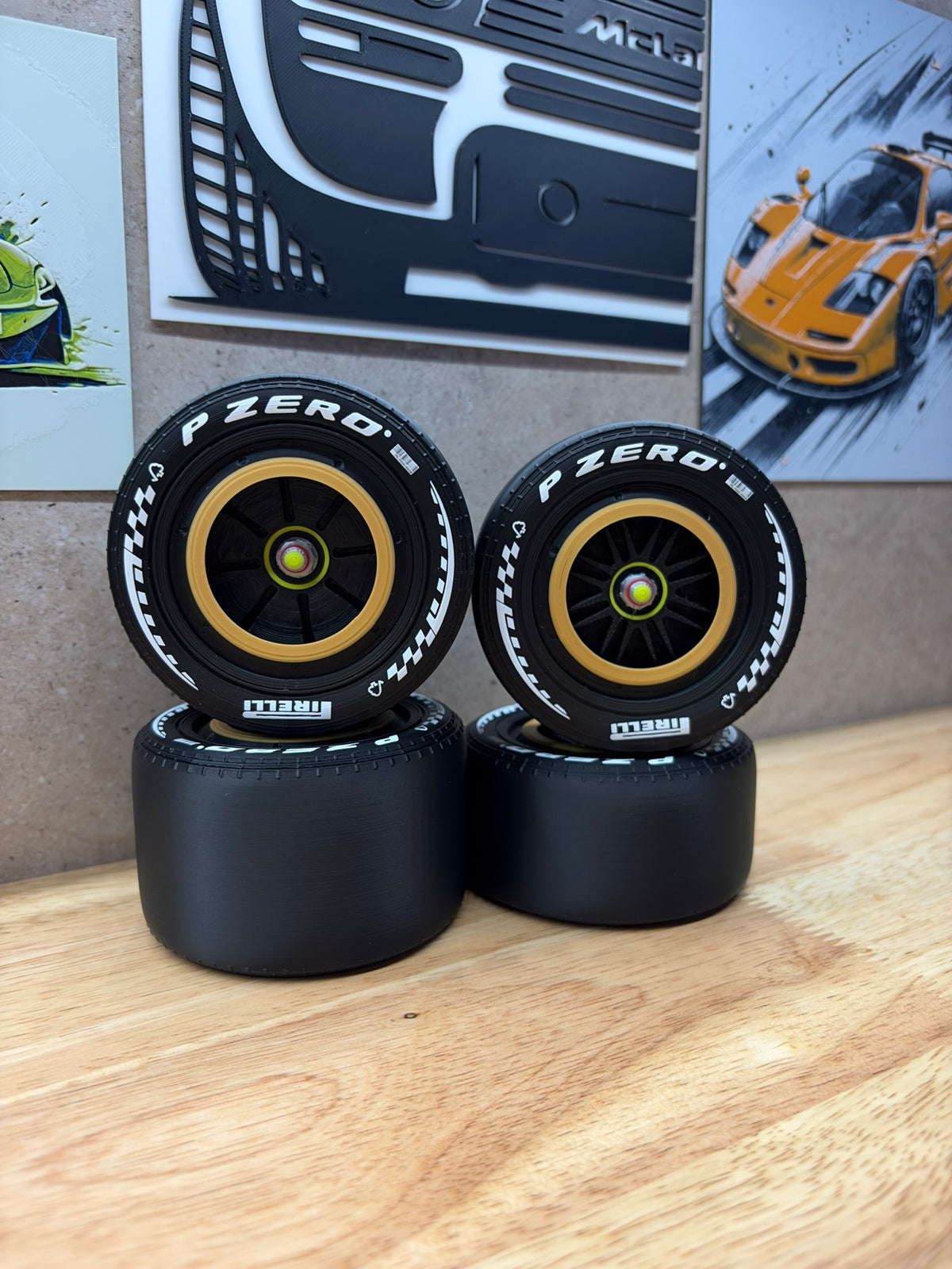 2026 Ferrari F1 Schumacher Monza Tribute 3D-printed wheels for 1:8 scale models, featuring white P Zero tyre markings, black spokes and distinctive gold wheel rims.